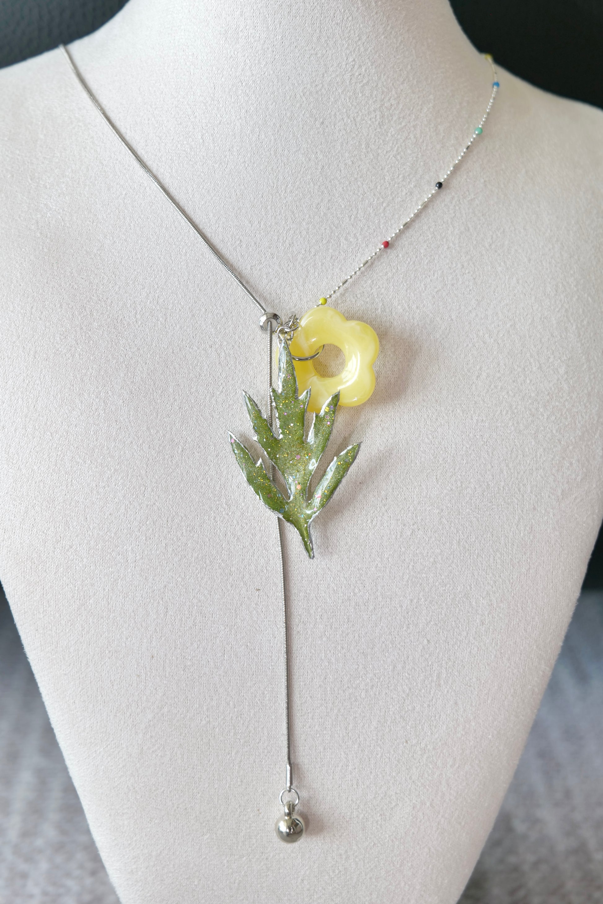 Front view of Chinese mugwort, coloured-bead chain and yellow acrylic flower charm