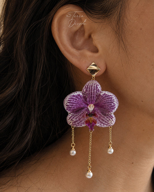 Purple orchid earrings with resin petals and pearl-like drops by Terra Decode