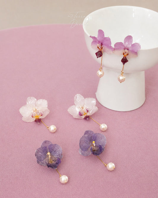 Soft pink, cream white and lavender orchid pearl drop earrings with resin petals by Terra Decode
