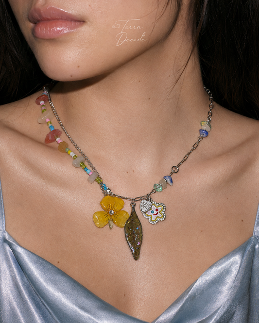 Model wearing the Yellow Pansy and Nandina Leaf Y2K Charm Necklace from Terra Decode's Flowers in Y2K collection